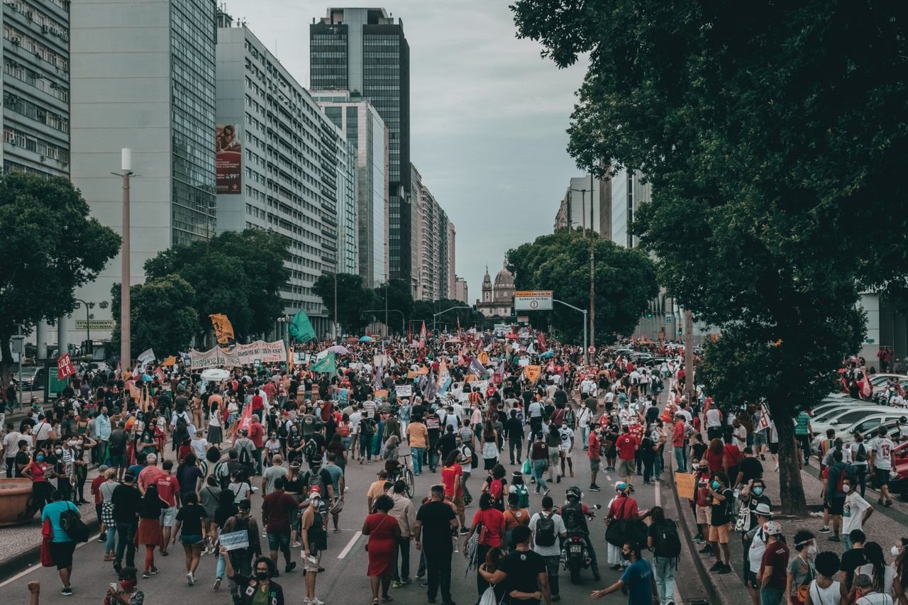 our-experience A large street protest with diverse crowd in Rio de Janeiro, Brasil.